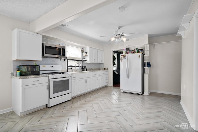 120 Riverside Dr, Montgomery, IL 60538 - kitchen with white appliances, ceiling fan, white cabinets, open shelves, and decorative backsplash