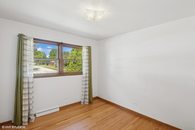 901 S Can Dota Ave, Mount Prospect, IL 60056 - spare room featuring a baseboard radiator and light wood-style floors