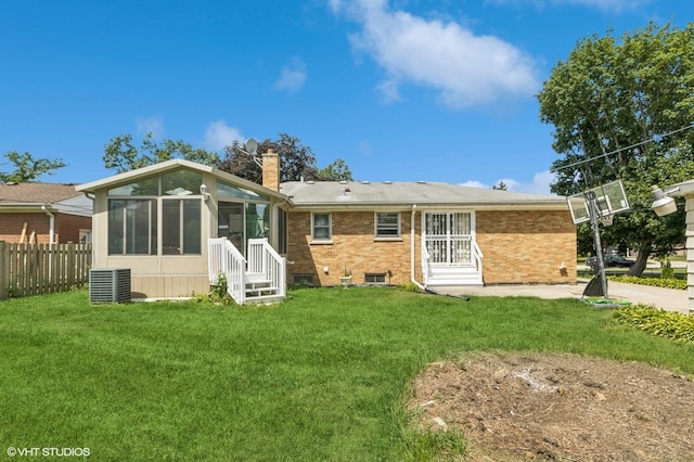 901 S Can Dota Ave, Mount Prospect, IL 60056 - rear view of house with entry steps, a sunroom, brick siding, and a chimney