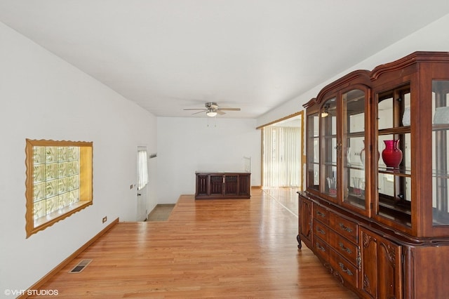 901 S Can Dota Ave, Mount Prospect, IL 60056 - unfurnished living room with light wood-style flooring, a ceiling fan, and healthy amount of natural light
