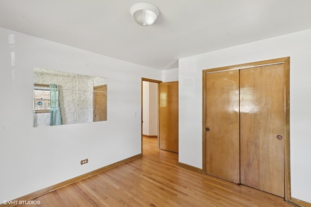 901 S Can Dota Ave, Mount Prospect, IL 60056 - unfurnished bedroom with light wood-style floors and a closet