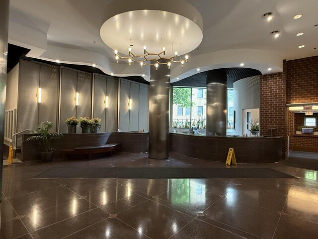 3660 N Lake Shore Dr Unit 1309, Chicago, IL 60613 - reception area featuring recessed lighting and brick wall