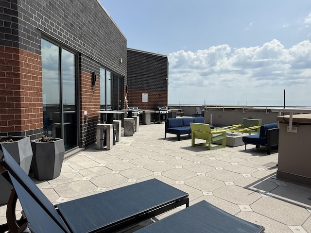 3660 N Lake Shore Dr Unit 1309, Chicago, IL 60613 - view of patio with outdoor lounge area and an outdoor kitchen