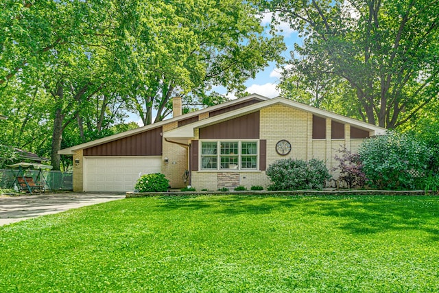 13007 S Oak Park Ave, Palos Heights, IL 60463 - mid-century modern home with brick siding, a chimney, an attached garage, driveway, and a front lawn