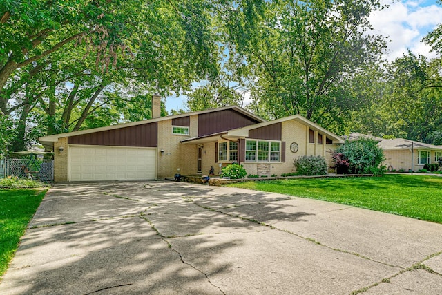 13007 S Oak Park Ave, Palos Heights, IL 60463 - mid-century inspired home with brick siding, a chimney, an attached garage, and driveway