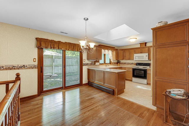 13007 S Oak Park Ave, Palos Heights, IL 60463 - kitchen featuring electric stove, white microwave, light wood finished floors, a chandelier, and wallpapered walls