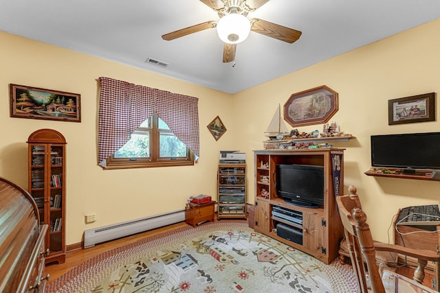 13007 S Oak Park Ave, Palos Heights, IL 60463 - living room with a baseboard radiator, wood finished floors, and a ceiling fan