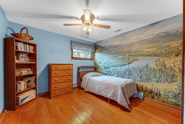 13007 S Oak Park Ave, Palos Heights, IL 60463 - bedroom featuring wood finished floors, a baseboard heating unit, and ceiling fan