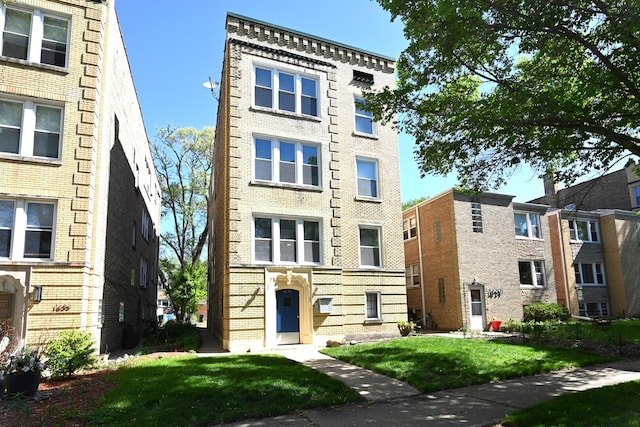 1631 Monroe St, Evanston, IL 60202 - view of front of house featuring brick siding and a front yard