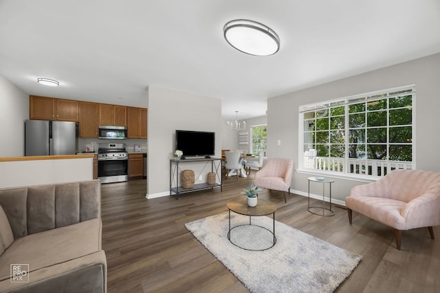 2416 Oakfield Dr Unit 2416, Aurora, IL 60503 - living room featuring dark wood-type flooring and a chandelier