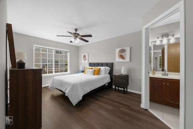 2416 Oakfield Dr Unit 2416, Aurora, IL 60503 - bedroom with dark wood-style flooring, multiple windows, ensuite bathroom, and a ceiling fan
