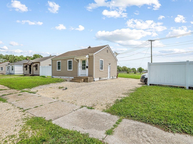 2228 Magnolia St, Rockford, IL 61104 - single story home with gravel driveway