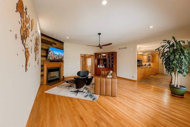 1102 Brian Dr, Manteno, IL 60950 - living area featuring a large fireplace, light wood finished floors, recessed lighting, and a ceiling fan