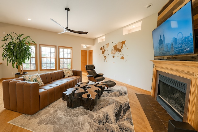 1102 Brian Dr, Manteno, IL 60950 - living area featuring ceiling fan, wood finished floors, a fireplace with flush hearth, and recessed lighting