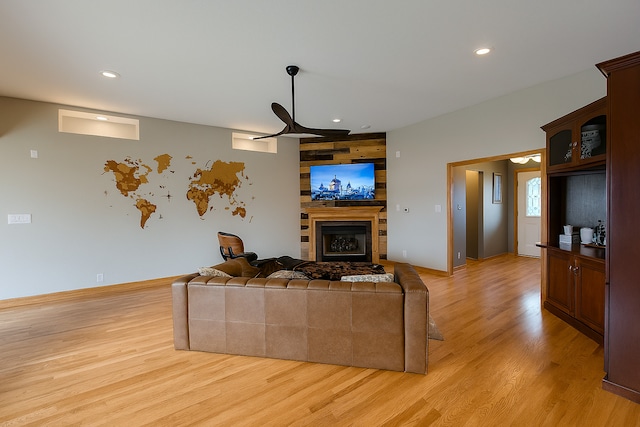 1102 Brian Dr, Manteno, IL 60950 - living room with light wood-style floors, a glass covered fireplace, and recessed lighting