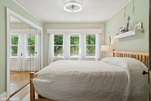 300 W Fremont St, Arlington Heights, IL 60004 - bedroom with crown molding, wood finished floors, and a closet