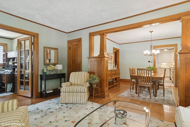 300 W Fremont St, Arlington Heights, IL 60004 - living room with wood finished floors, a chandelier, and crown molding