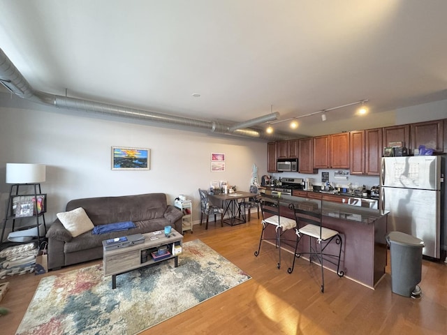1200 W Monroe St Unit 516, Chicago, IL 60607 - living room with light wood-style flooring and track lighting