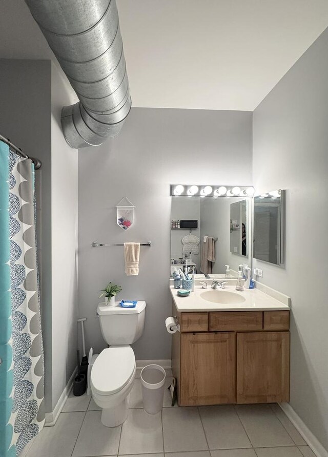 1200 W Monroe St Unit 516, Chicago, IL 60607 - bathroom with vanity, tile patterned floors, and curtained shower