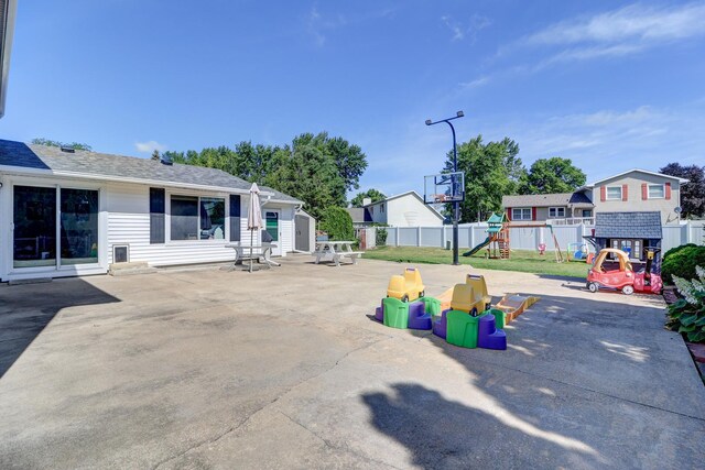 1002 E 19th St, Sterling, IL 61081 - view of patio with a playground and a shed