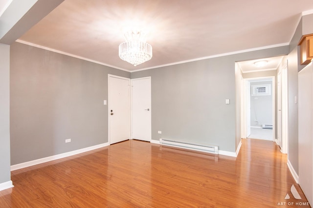 8049 Beloit Ave Unit 2C, Bridgeview, IL 60455 - spare room featuring a baseboard heating unit, light wood-style flooring, a chandelier, and crown molding