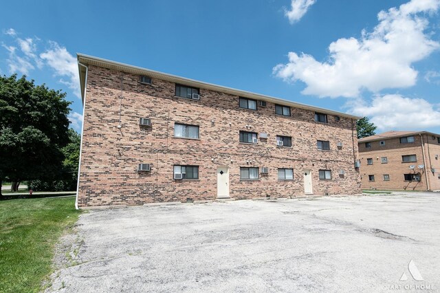 8049 Beloit Ave Unit 2C, Bridgeview, IL 60455 - view of property featuring uncovered parking