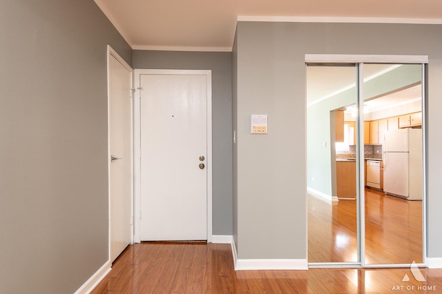 8049 Beloit Ave Unit 2C, Bridgeview, IL 60455 - hallway with light wood-style floors and crown molding