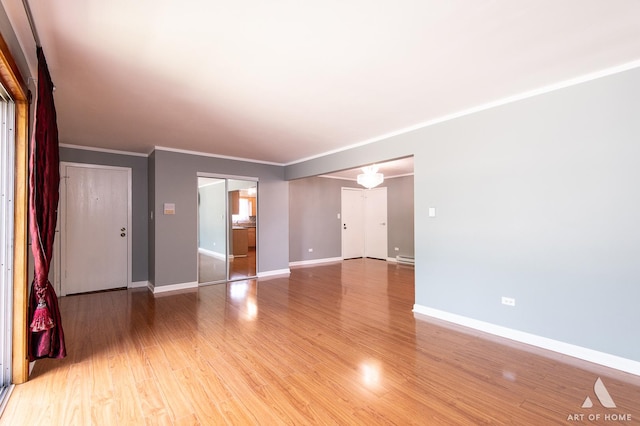 8049 Beloit Ave Unit 2C, Bridgeview, IL 60455 - unfurnished room with light wood-type flooring and crown molding