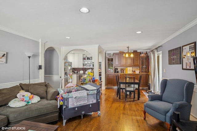 1217 S Old Wilke Rd Unit 101, Arlington Heights, IL 60005 - living area featuring a chandelier, crown molding, wood finished floors, arched walkways, and recessed lighting