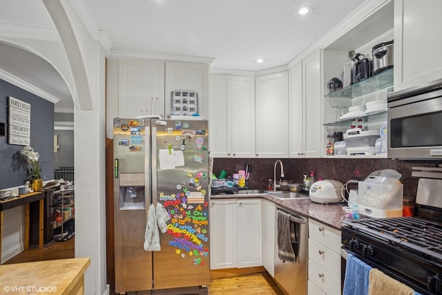 1217 S Old Wilke Rd Unit 101, Arlington Heights, IL 60005 - kitchen featuring appliances with stainless steel finishes, crown molding, white cabinets, open shelves, and decorative backsplash