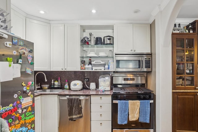 1217 S Old Wilke Rd Unit 101, Arlington Heights, IL 60005 - kitchen with appliances with stainless steel finishes, arched walkways, white cabinets, and crown molding