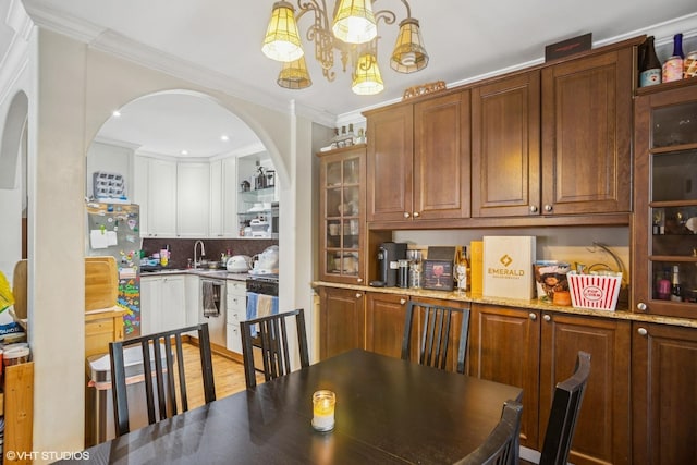 1217 S Old Wilke Rd Unit 101, Arlington Heights, IL 60005 - dining room with arched walkways, a chandelier, crown molding, and recessed lighting