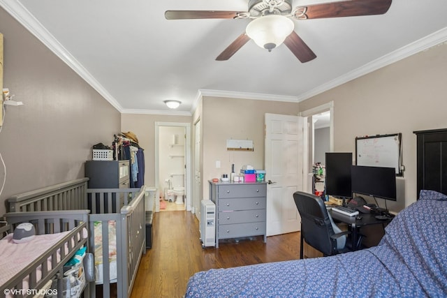 1217 S Old Wilke Rd Unit 101, Arlington Heights, IL 60005 - bedroom with wood finished floors, ornamental molding, a desk, and ceiling fan