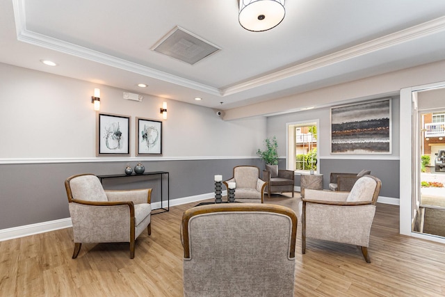 390 W Mahogany Ct Unit 301, Palatine, IL 60067 - sitting room with a tray ceiling, crown molding, light wood-type flooring, and recessed lighting
