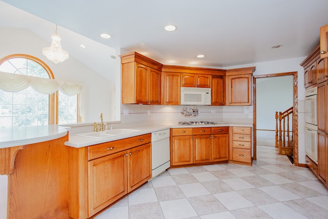 535 Weidner Rd, Buffalo Grove, IL 60089 - kitchen featuring white appliances, light countertops, lofted ceiling, hanging light fixtures, and tasteful backsplash