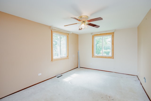535 Weidner Rd, Buffalo Grove, IL 60089 - spare room featuring plenty of natural light, ceiling fan, and light colored carpet