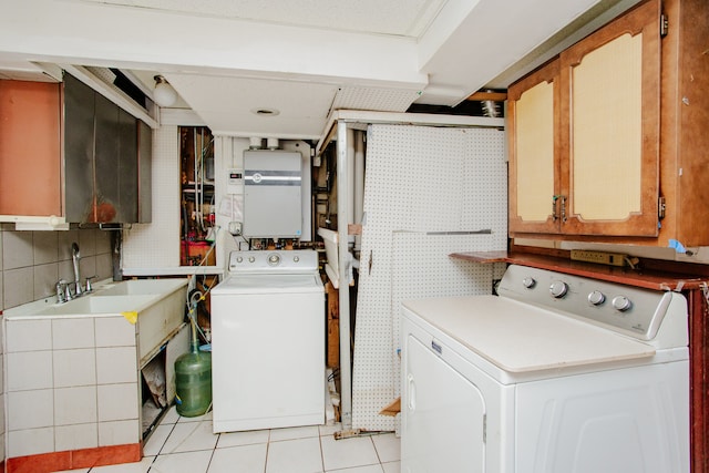535 Weidner Rd, Buffalo Grove, IL 60089 - laundry room with washing machine and clothes dryer, tankless water heater, light tile patterned floors, and cabinet space