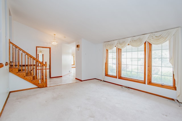535 Weidner Rd, Buffalo Grove, IL 60089 - unfurnished living room featuring a chandelier, vaulted ceiling, carpet flooring, and stairs