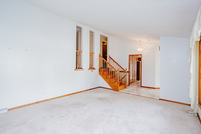 535 Weidner Rd, Buffalo Grove, IL 60089 - carpeted spare room with stairs and a chandelier