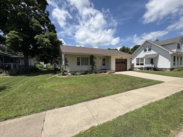 126 N Randolph St, Princeton, IL 61356 - view of front of home featuring driveway, an attached garage, and a front lawn