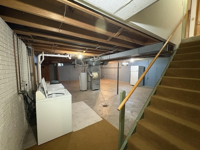 126 N Randolph St, Princeton, IL 61356 - unfinished basement featuring independent washer and dryer, stairway, freestanding refrigerator, and heating unit
