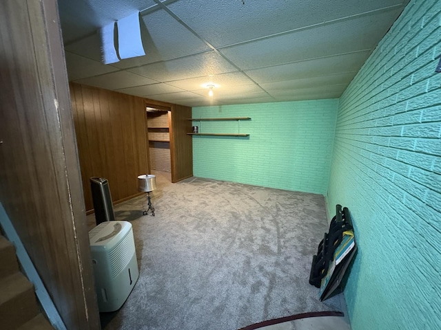 126 N Randolph St, Princeton, IL 61356 - sitting room with carpet, wood walls, and a drop ceiling