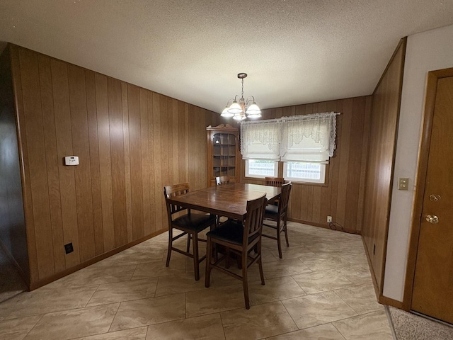 126 N Randolph St, Princeton, IL 61356 - dining area with wood walls and a chandelier