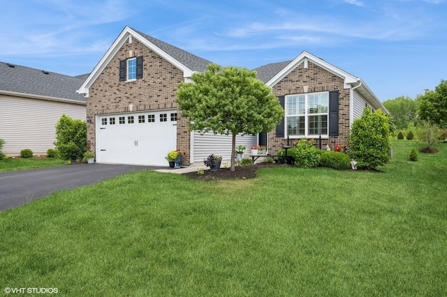 321 Mahogany Dr, Algonquin, IL 60102 - view of front of home featuring brick siding, driveway, and a front lawn