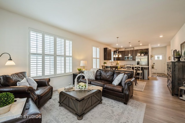 321 Mahogany Dr, Algonquin, IL 60102 - living room with plenty of natural light, light wood-style floors, a chandelier, and recessed lighting