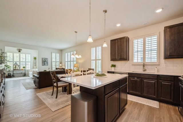 321 Mahogany Dr, Algonquin, IL 60102 - kitchen with healthy amount of natural light, light wood-style flooring, dark brown cabinetry, and recessed lighting