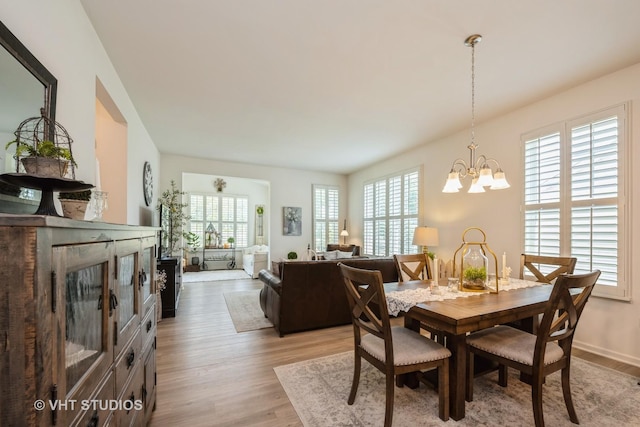 321 Mahogany Dr, Algonquin, IL 60102 - dining area featuring light wood-type flooring and a chandelier