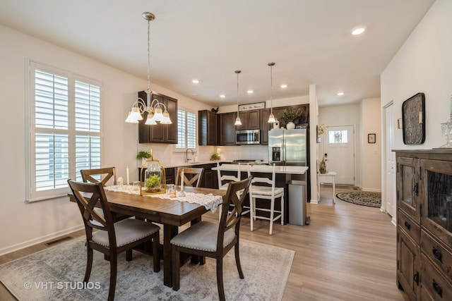 321 Mahogany Dr, Algonquin, IL 60102 - dining space with a chandelier, light wood finished floors, and recessed lighting