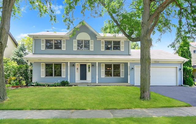 1268 Country Glen Ln, Carol Stream, IL 60188 - view of front facade featuring an attached garage, driveway, covered porch, and a front lawn