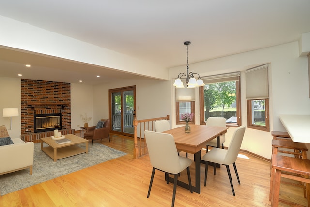 1268 Country Glen Ln, Carol Stream, IL 60188 - dining area with light wood finished floors, plenty of natural light, a chandelier, a fireplace, and recessed lighting